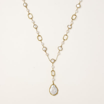 Y-shaped gold-plated necklace with freshwater pearls and geometric elements, featuring a baroque pearl pendant drop