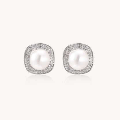 Sterling silver stud earrings with round freshwater pearls surrounded by sparkling crystal halos on white background.