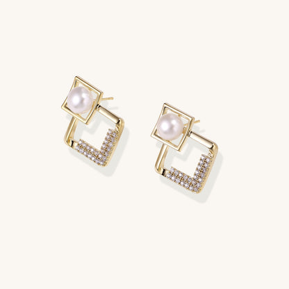 Gold-plated geometric drop earrings with freshwater pearls in square frames and crystal-accented diamond-shaped dangles