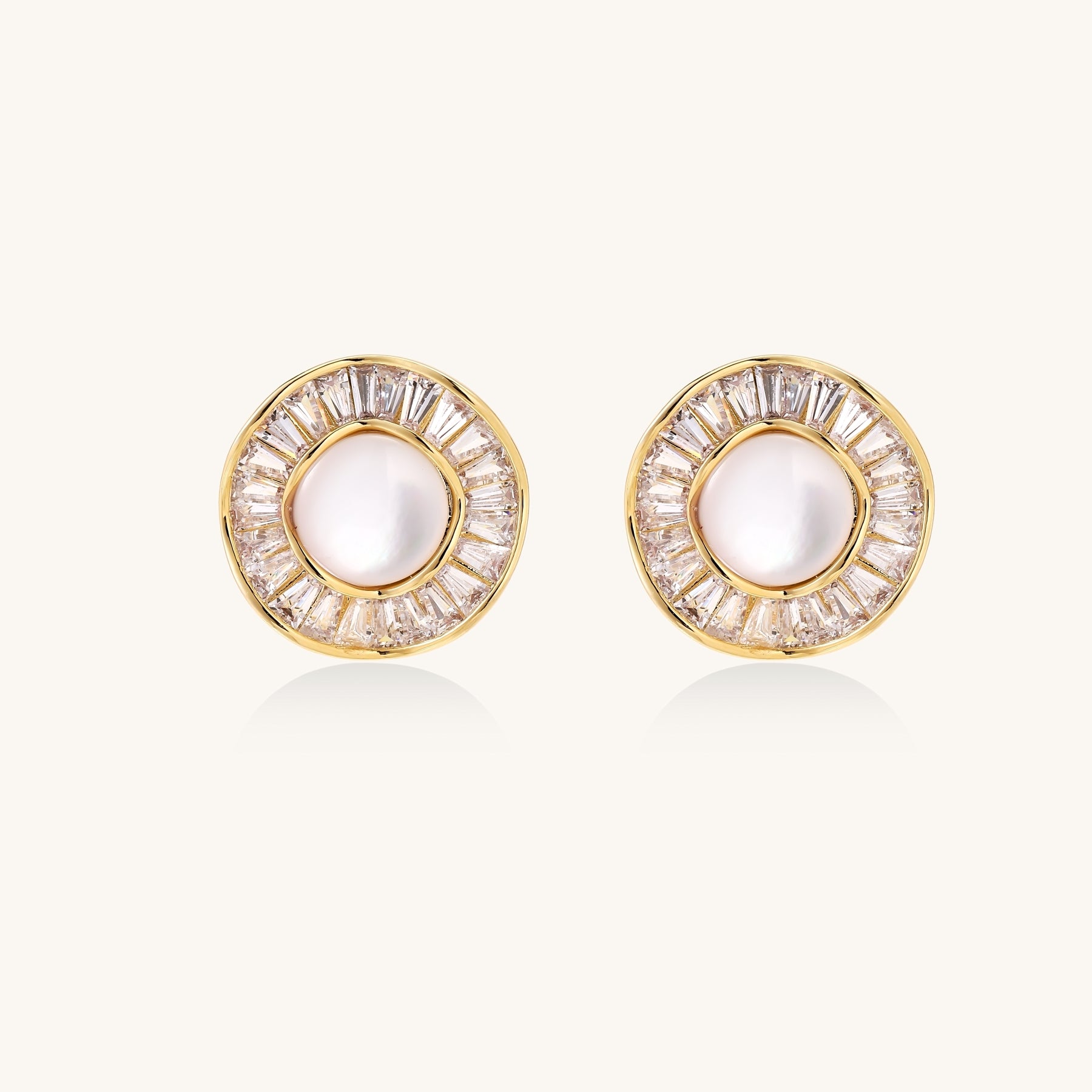 Gold-plated stud earrings with central freshwater pearl surrounded by baguette crystals in radial pattern