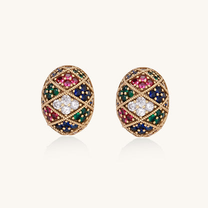 Oval gold-plated stud earrings with multicolor zirconia stones in geometric diamond pattern on white background.