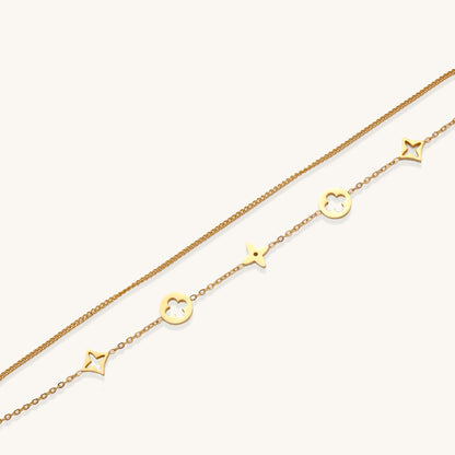 Dainty gold-plated bracelet with star and clover charms on double chain with adjustable extender