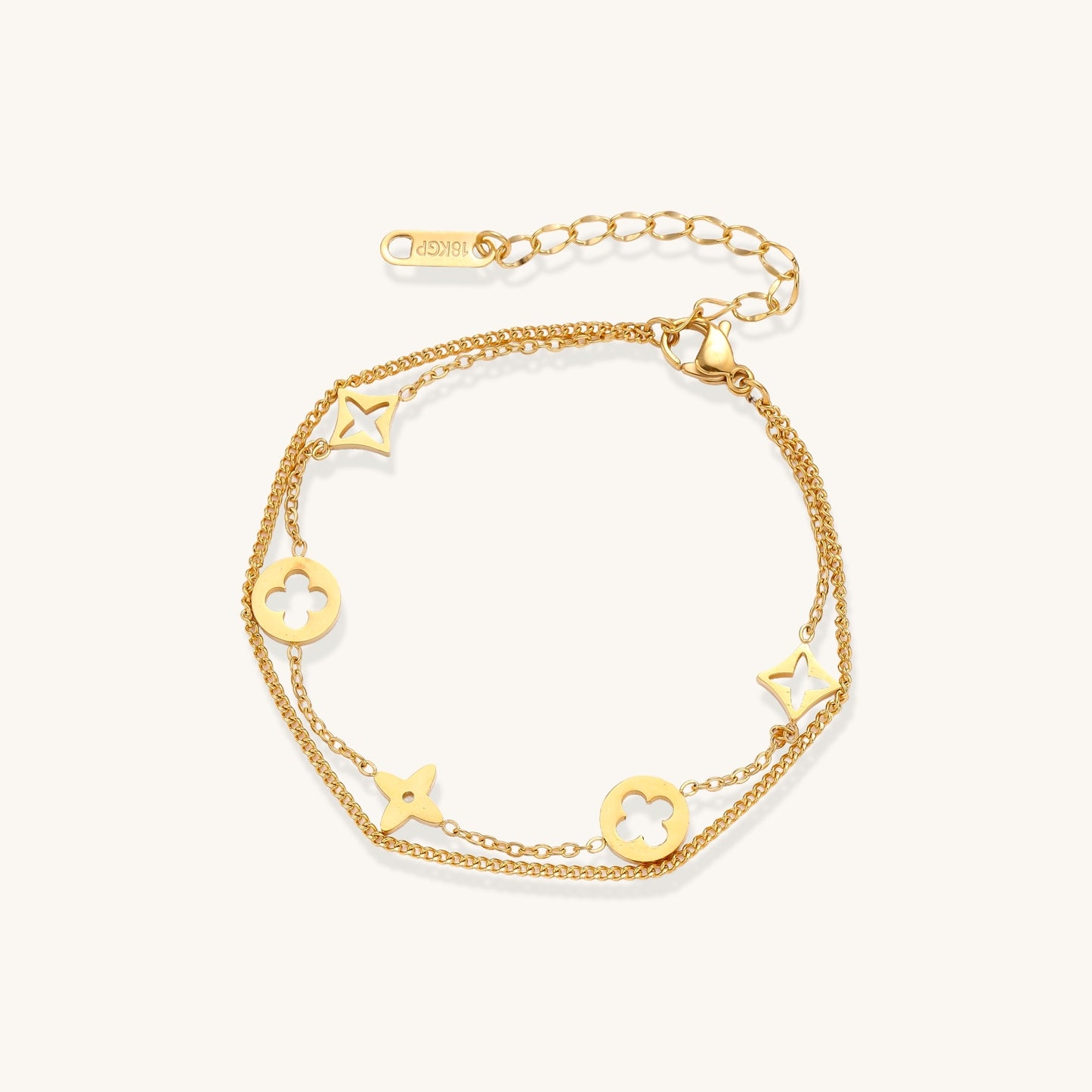 Dainty gold-plated bracelet with star and clover charms on double chain with adjustable extender