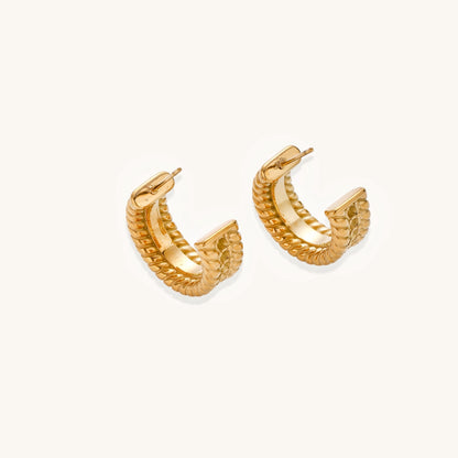 Close-up of 14K gold plated textured hoop earrings with rope pattern against cream background showing convertible design