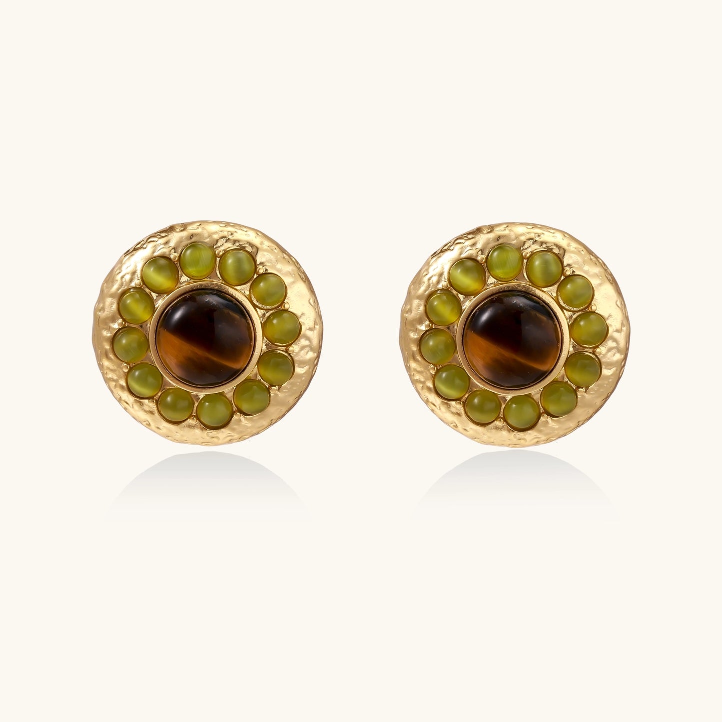 Gold-plated circular earrings featuring central tiger's eye stones surrounded by green liuli beads on textured metal base