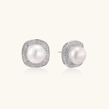 Cushion-shaped sterling silver stud earrings with freshwater pearls surrounded by geometric diamond halos
