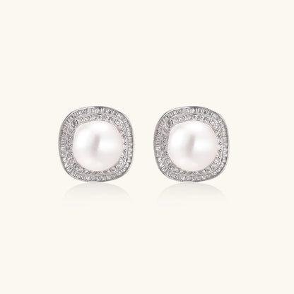 Cushion-shaped sterling silver stud earrings with freshwater pearls surrounded by geometric diamond halos