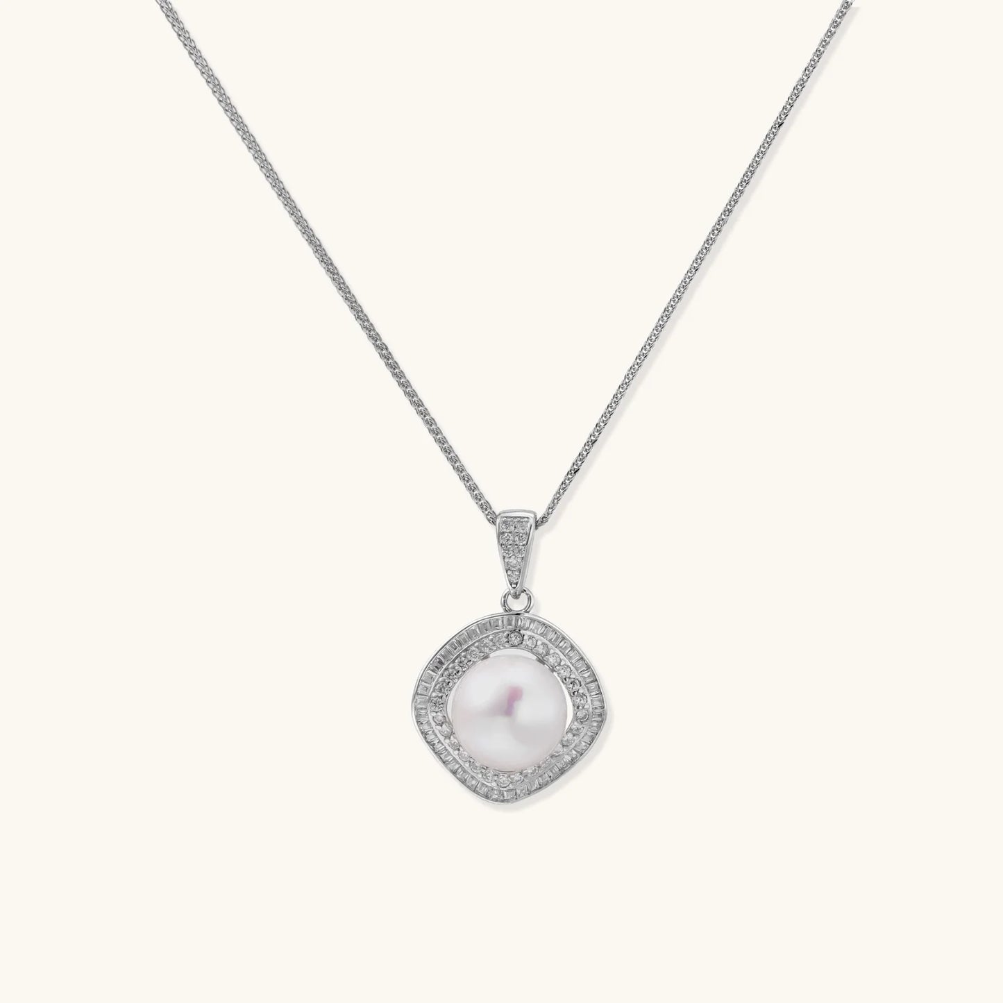 Cushion-shaped double halo pendant with 10mm freshwater pearl center on rhodium-plated sterling silver chain