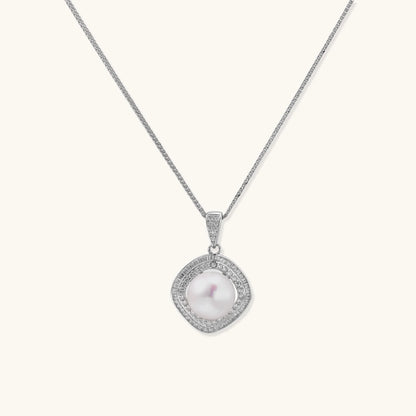 Cushion-shaped double halo pendant with 10mm freshwater pearl center on rhodium-plated sterling silver chain