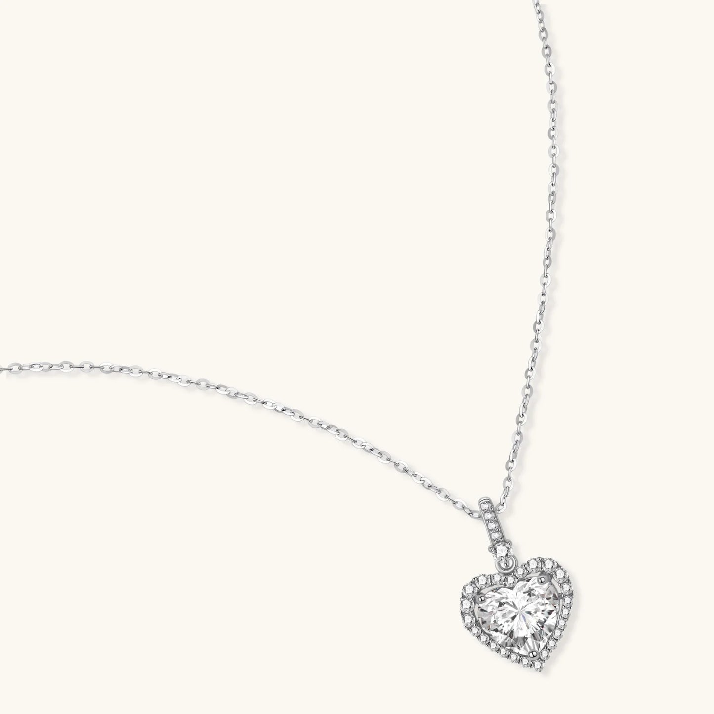Sterling silver heart pendant necklace with brilliant moissanite center stone and halo setting on delicate chain