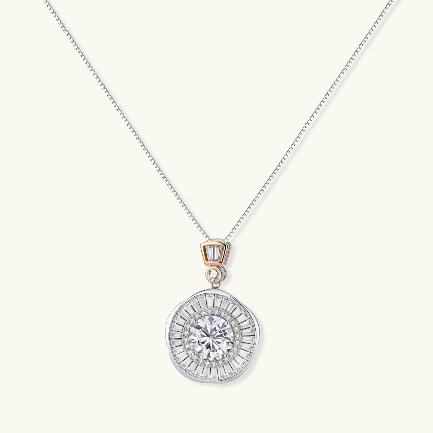 Sterling silver necklace with circular geometric pendant featuring central moissanite and radial baguette pattern.