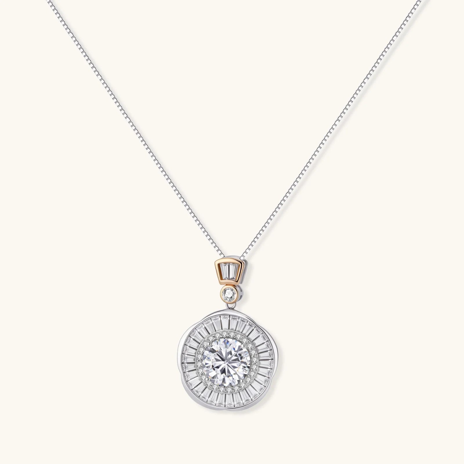 Sterling silver necklace with circular geometric pendant featuring central moissanite and radial baguette pattern.