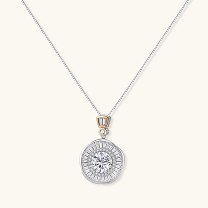 Sterling silver necklace with circular geometric pendant featuring central moissanite and radial baguette pattern.