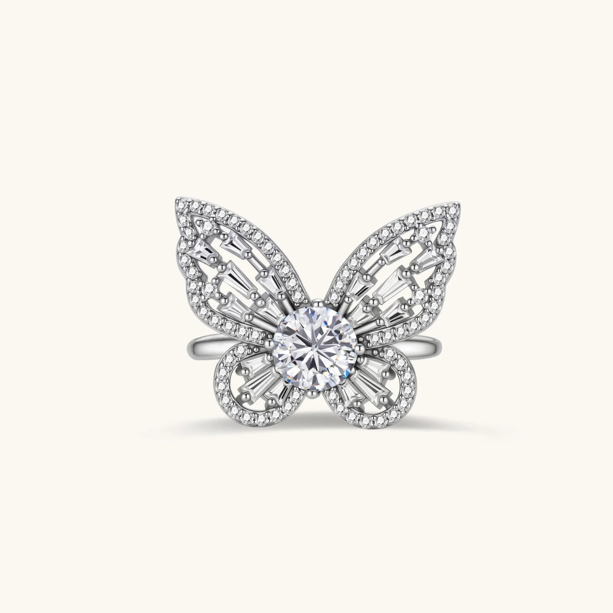 Sterling silver butterfly ring with central moissanite and baguette-cut stones forming intricate wing patterns