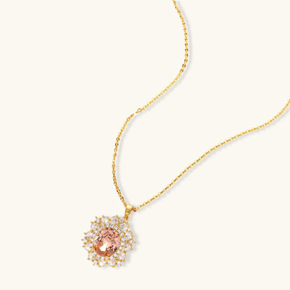 Ornate gold-plated jewelry set featuring peach center stone surrounded by clear AAA cubic zirconia crystals