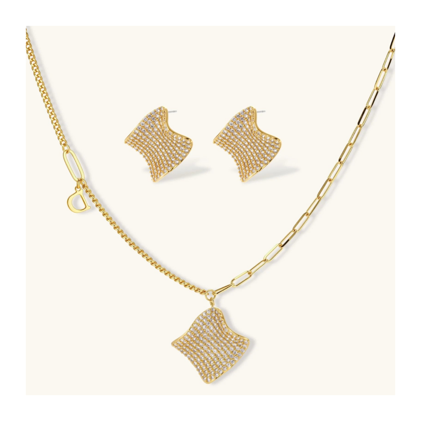 Gold-plated wavy jewelry set with crystal detailing featuring necklace with dual chains and matching textured earrings