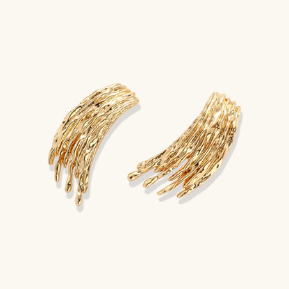 Gold-toned cascade jewelry set with flowing textured strands, featuring drop earrings and matching pendant necklace