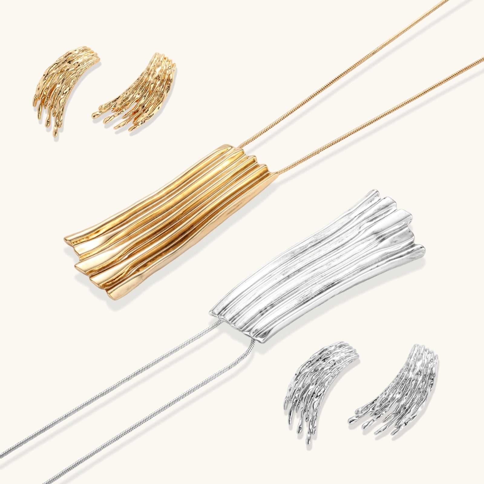 Gold-toned cascade jewelry set with flowing textured strands, featuring drop earrings and matching pendant necklace
