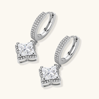 Sterling silver huggie hoops with geometric diamond-shaped moissanite dangles featuring pavé crystal details