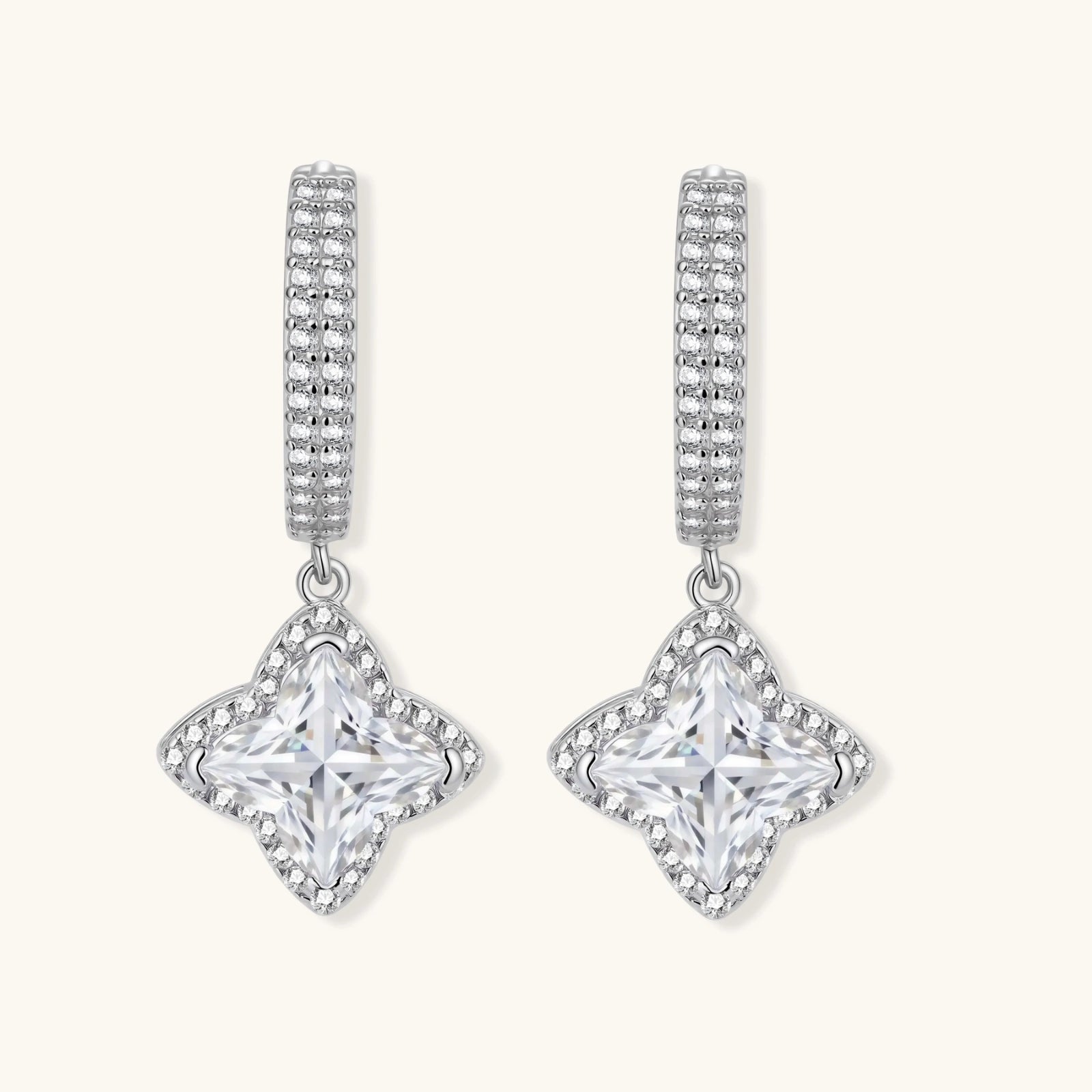 Sterling silver huggie hoops with geometric diamond-shaped moissanite dangles featuring pavé crystal details