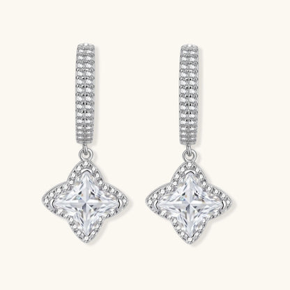 Sterling silver huggie hoops with geometric diamond-shaped moissanite dangles featuring pavé crystal details