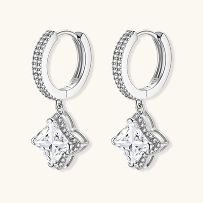 Sterling silver huggie hoops with geometric diamond-shaped moissanite dangles featuring pavé crystal details