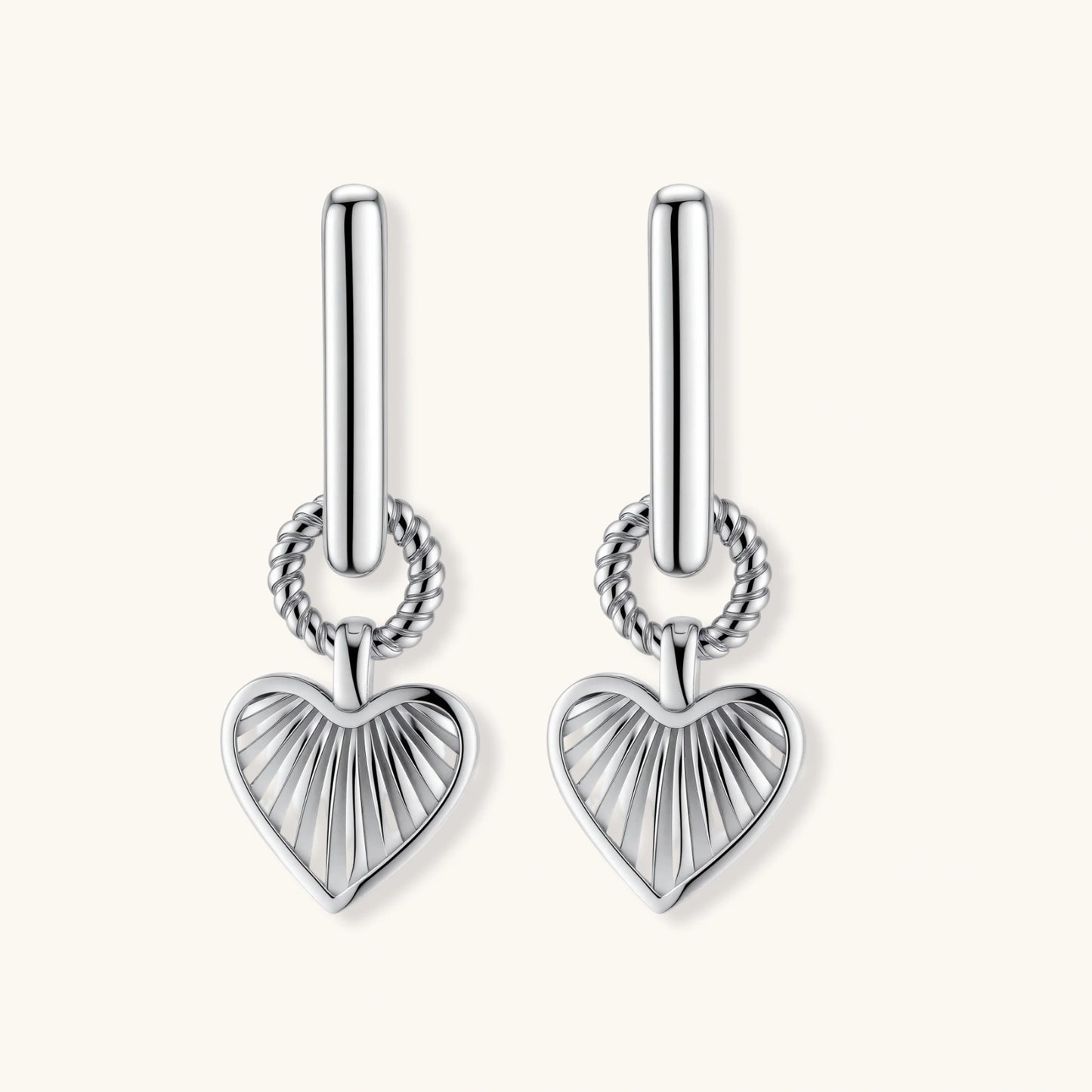 Platinum-plated 925 sterling silver rectangular hoop earrings with twisted ring connector and ribbed heart charm pendant.