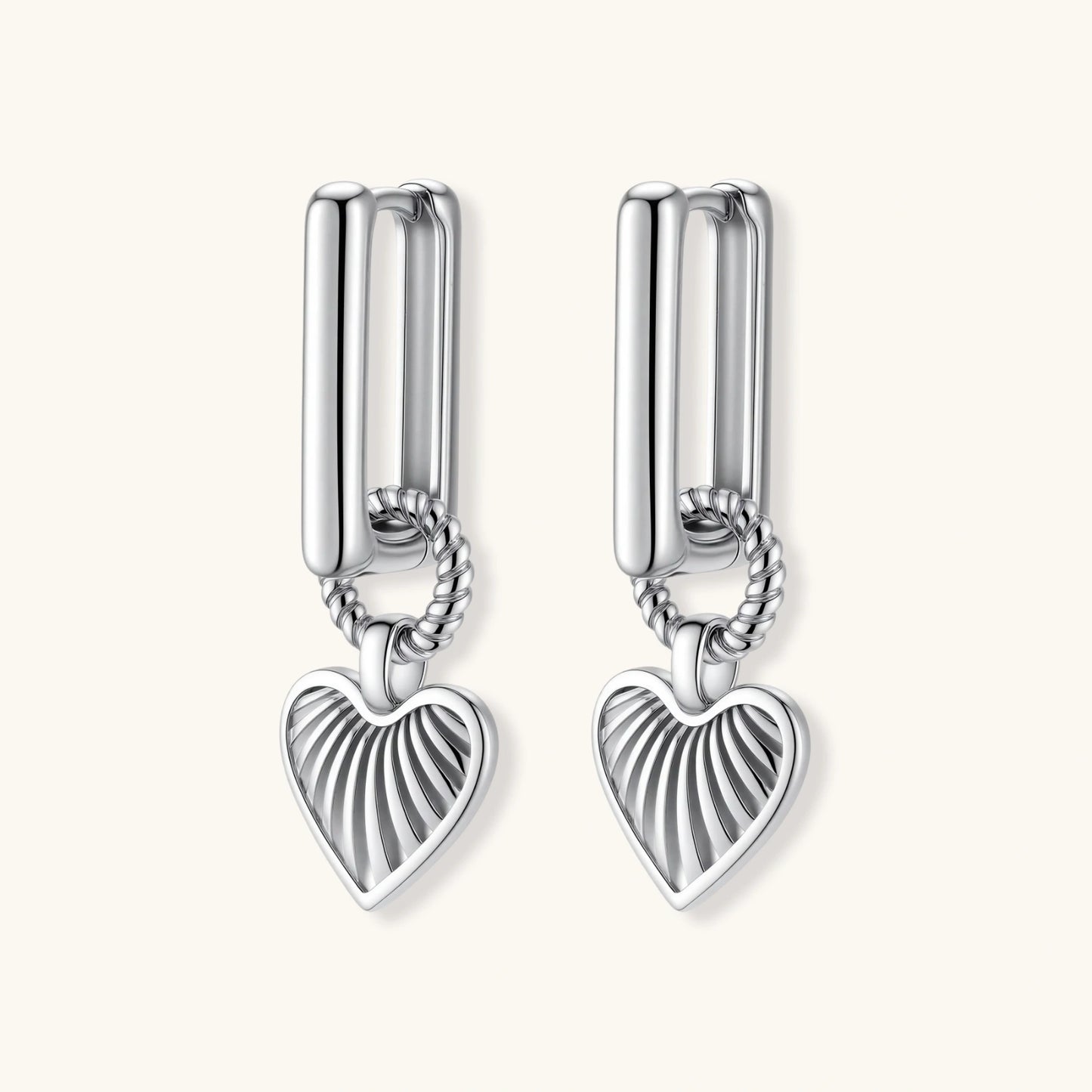 Platinum-plated 925 sterling silver rectangular hoop earrings with twisted ring connector and ribbed heart charm pendant.