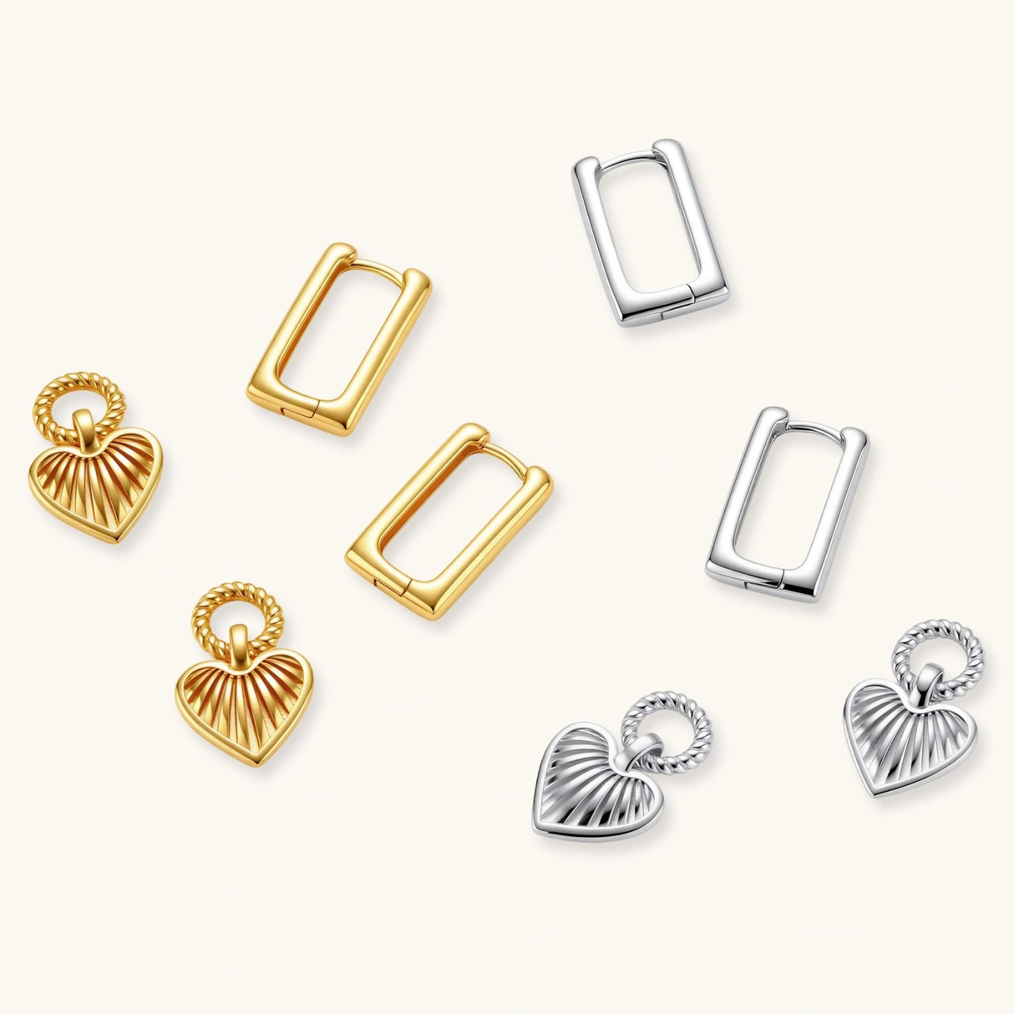 Platinum-plated 925 sterling silver rectangular hoop earrings with twisted ring connector and ribbed heart charm pendant.